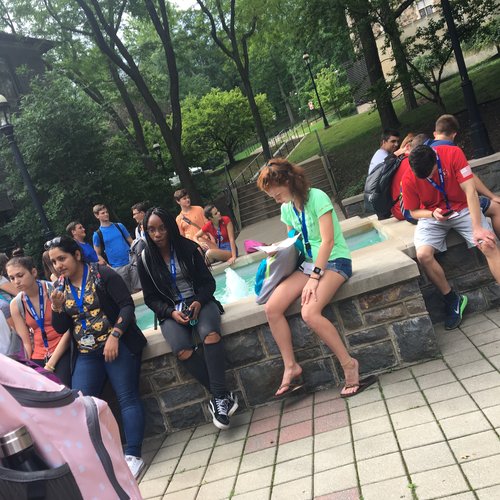 Waiting to go to class by the fountain 